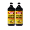 2 bottles of bragg's liquid aminos soy protein seasoning front view angle